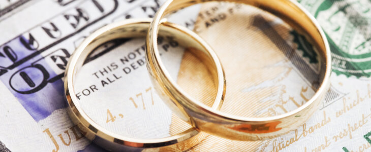 money and wedding rings representing high asset divorce in midland texas