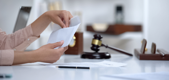 A person mails money for spousal support