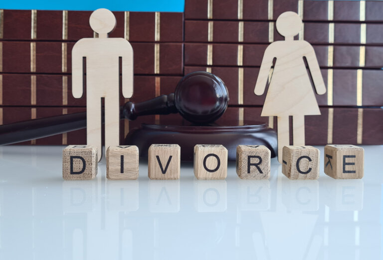 shows a white surface with wooden blocks spelling out the word DIVORCE