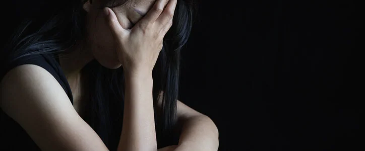 Victim of domestic violence crying