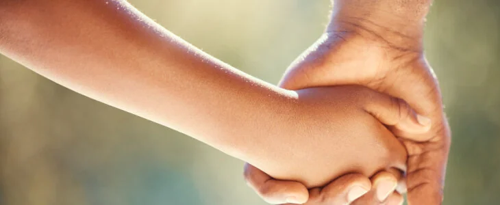person holding a child hand