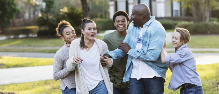 A blended family laughs together