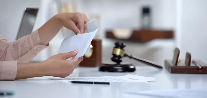 A person mails money for spousal support