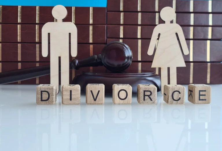 shows a white surface with wooden blocks spelling out the word DIVORCE